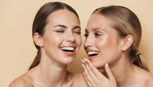 Two women smiling at eachother